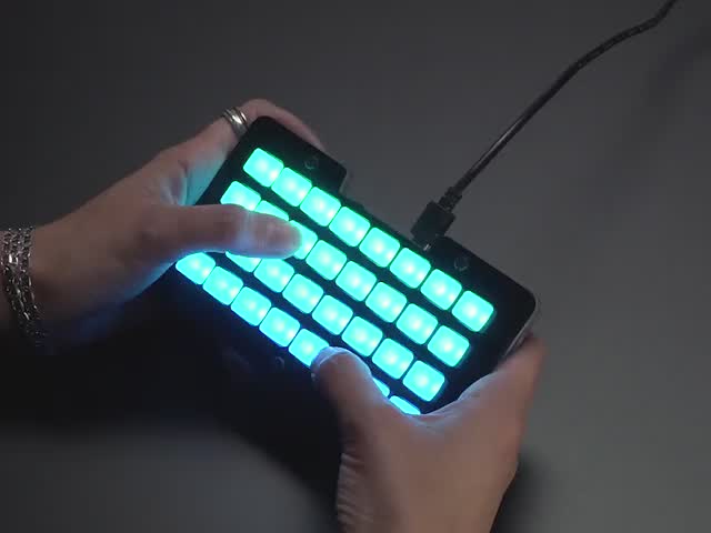 Adafruit NeoTrellis M4 with Enclosure and Buttons Kit Pack - Demo Video of Hands pressing buttons on lit up NeoTrellis M4.